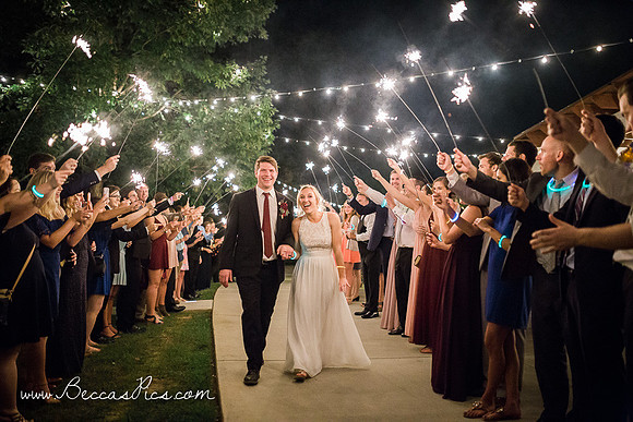 bride and groom doing a sparkler exit at their wedding at Dewberry Farm in Kernersville NC