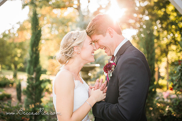 bride and groom backlit from sunset laughing at dewberry farm in kernersville nc