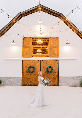 Bride in front of Barn at Cranberry Creek